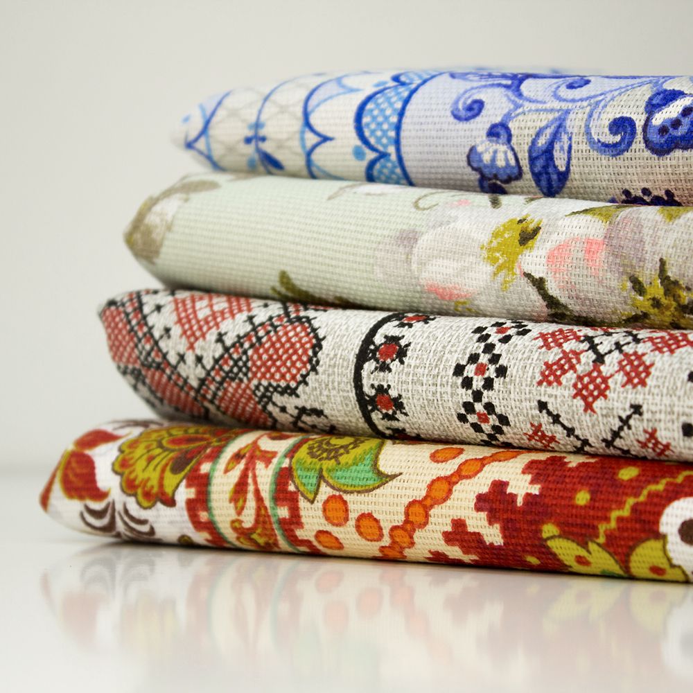 Printed fabrics folded and stacked featuring digital printed artwork on Art Fabrics. 