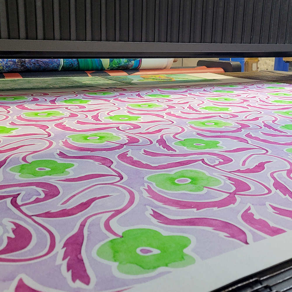 Custom printed cotton canvas fabric with floral fabric print in magenta and green.